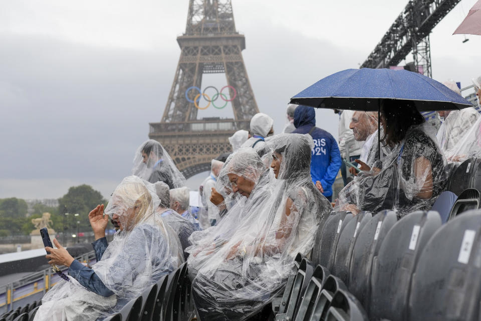 Spectators wait for the opening ceremony of the 2024 Summer Olympics to begin in Paris, France, Friday, July 26, 2024. / Credit: Thibault Camus / AP