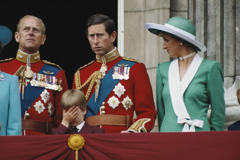 <div class="inline-image__caption"><p>Prince Philip, Prince Charles and Diana, Princess of Wales, and Prince William, who is holding his hand over his eyes, as they stand on the balcony of Buckingham Palace for the Trooping the Color ceremony, London, 11 June 1988.</p></div> <div class="inline-image__credit">Tim Graham Photo Library via Getty</div>