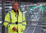 Ocado robots are seen inside a warehouse in Erith