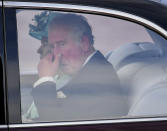 Britain's Queen Elizabeth II and Prince Charles arrive back at Buckingham Palace after the state opening of Parliament, in London, Thursday, Dec. 19, 2019. Queen Elizabeth II will formally open a new session of Britain's Parliament, with a speech giving the first concrete details of what Prime Minister Boris Johnson plans to do with his commanding new majority. (AP Photo/Alberto Pezzali)