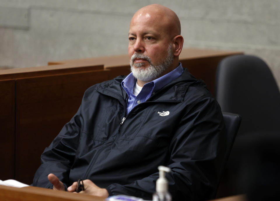 Columbus, Ohio, police detective Jeffery Huhn testifies during a bond hearing for Gerson Fuentes, the man accused of raping a 10-year-old girl who then traveled to Indiana to have an abortion, in Franklin County common pleas court Thursday, July 28, 2022. Judge Julie Lynch denied bond. (AP Photo/Paul Vernon)