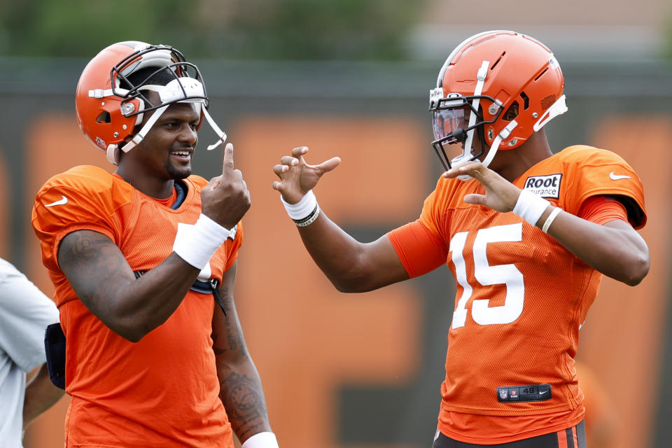 Cleveland Browns quarterback Deshaun Watson, left, talks with quarterback Joshua Dobbs during the NFL football team's training camp, Tuesday, Aug. 9, 2022, in Berea, Ohio. (AP Photo/Ron Schwane)