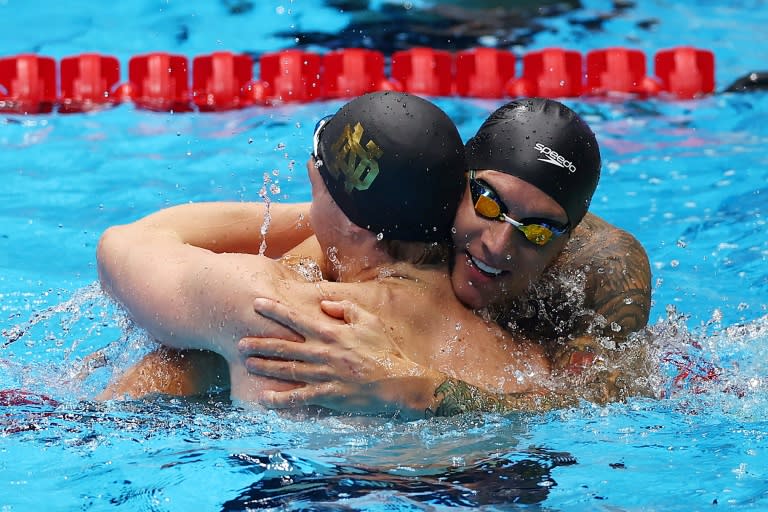 Caeleb Dressel and Chris Guiliano share a hug after finishing one-two in the 50m freestyle at the US Olympic swimming trials (Sarah Stier)