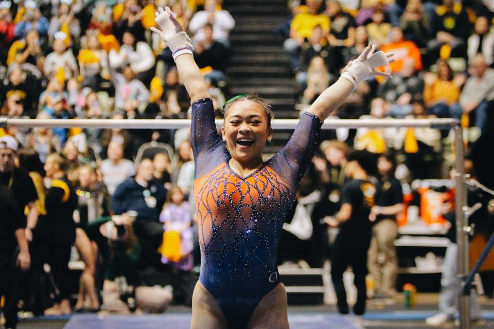 Auburn's Sunisa Lee smiles after performing her uneven bar routine during a college gymnastics meet against the University of Missouri on Feb. 19, 2023, at the Hearnes Center in Columbia, Mo. Lee scored a 9.950 on the routine.