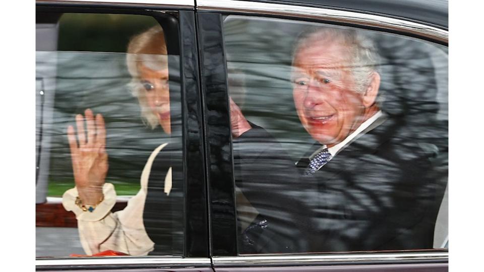 King Charles III and Queen Camilla wave as they leave by car from Clarence House in London 