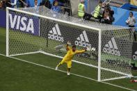 <p>Russia’s Alexander Golovin scores his side’s fifth goal as Saudi Arabia goalkeeper Abdullah Almuaiouf makes an attempt to stop the ball during the group A match between Russia and Saudi Arabia which opens the 2018 soccer World Cup at the Luzhniki stadium in Moscow, Russia, Thursday, June 14, 2018. Russia won 5-0. (AP Photo/Darko Bandic) </p>