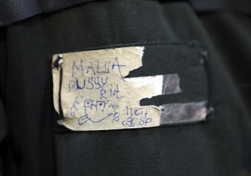 A close up of the coat badge of Alyokhina, member of Russian punk band Pussy Riot, speaks to the media after her release from a penal colony in Nizhny Novgorod