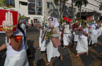 Demonstrators display placards with pictures of deposed Myanmar leader Aung San Suu Kyi and three-fingered salutes to protest against the military coup in Yangon, Myanmar Wednesday, Feb. 17, 2021. The U.N. expert on human rights in Myanmar warned of the prospect for major violence as demonstrators gather again Wednesday to protest the military's seizure of power. (AP Photo)