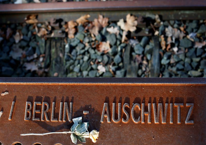 A frozen rose is seen at the Gleis 17 (Platform 17) memorial at Berlin-Grunewald train station in Berlin