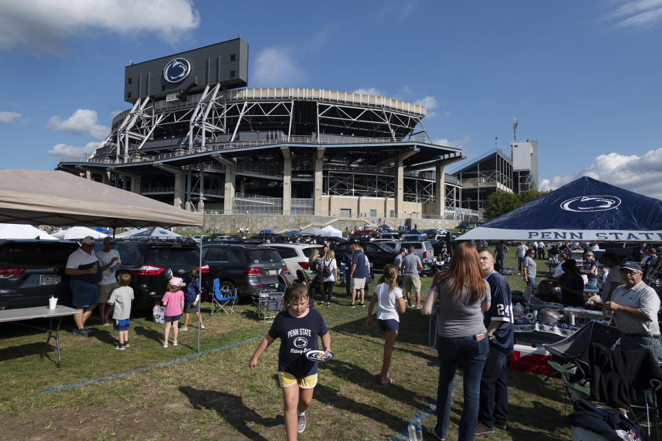 Fans tailgate outside of Beaver Stadium before an NCAA college football game between Penn State and Buffalo in State College, Pa., on Saturday, Sept. 7, 2019. (AP Photo/Barry Reeger)