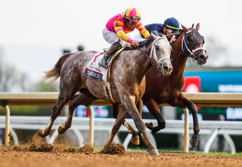 Luis Saez piloted Tapit Trice past Tyler Gaffalione aboard Verifying to win the 2023 Toyota Blue Grass Stakes April 8, 2023 at Keeneland.