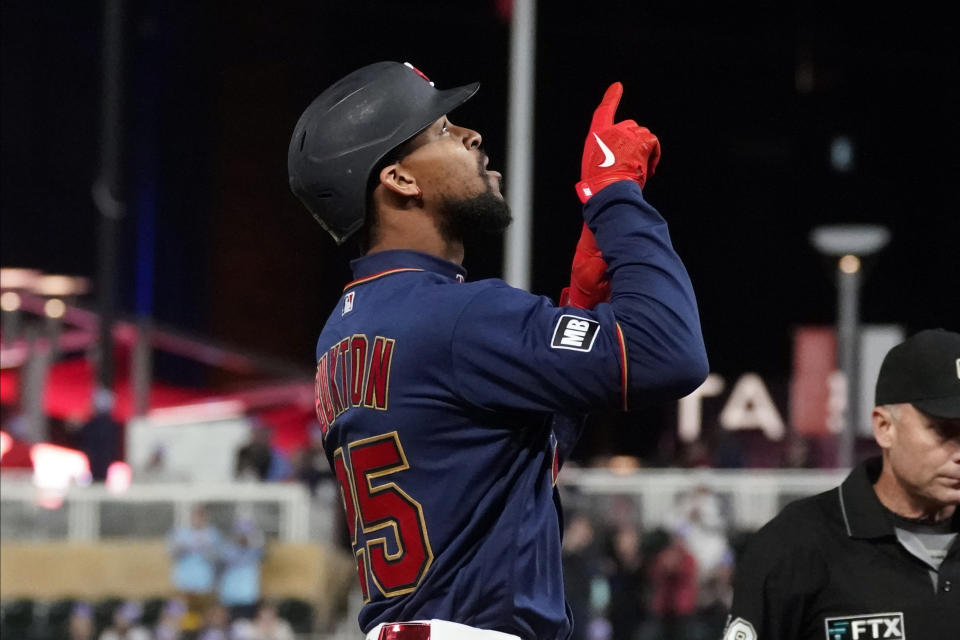 Minnesota Twins' Byron Buxton points skyward after his three-run home run off Toronto Blue Jays pitcher Jose Berrios in the third inning of a baseball game, Friday, Sept. 24, 2021, in Minneapolis. (AP Photo/Jim Mone)