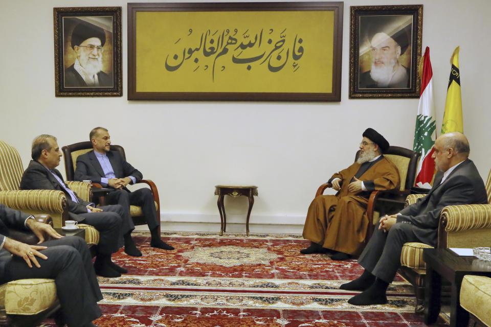 In this photoreleased by the Hezbollah Media Relations Office, Hezbollah leader Sayyed Hassan Nasrallah, second right, meets with Iranian Foreign Minister Hossein Amirabdollahian, second left, in Beirut, Lebanon, Saturday, Feb. 10, 2024. (Hezbollah Media Relations Office, via AP)