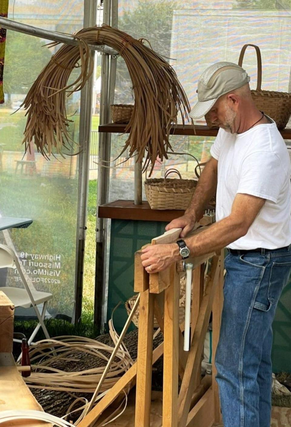 Aaron Holsapple demonstrates how to make a white oak basket at the Smithsonian Folklife Festival in Washington D.C. on Thursday, June 29, 2023.