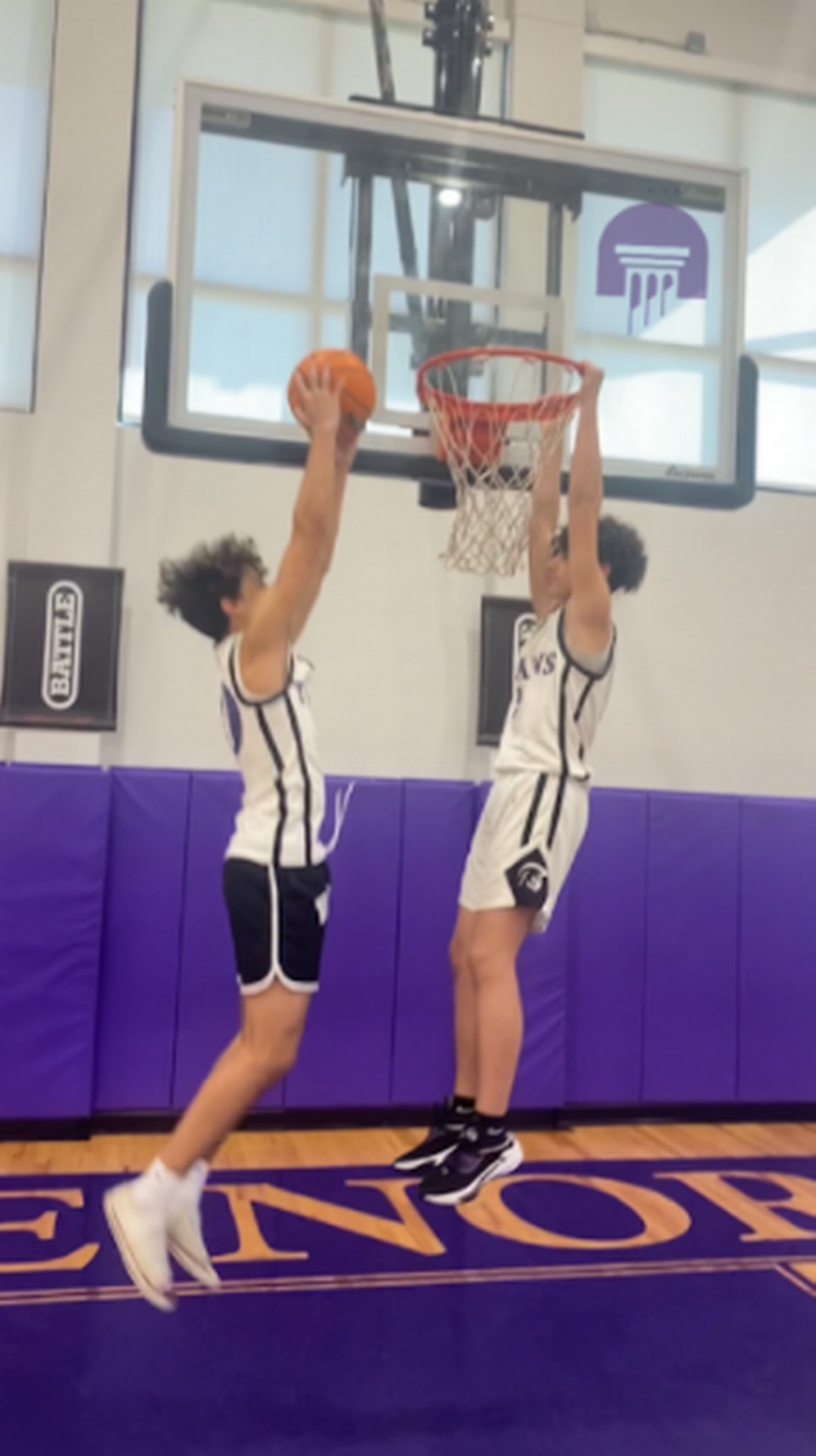 Sophomore Robbie Finlay (left) and 8th grader J-Roc Lopez of the True North Classical Academy boys’ basketball team.