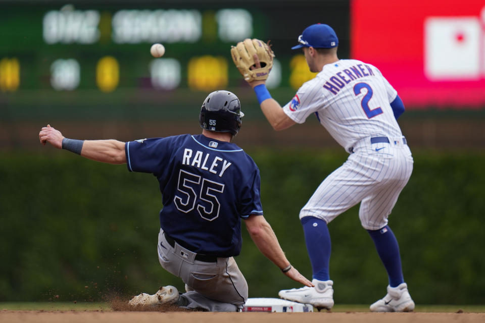 Tampa Bay Rays' Luke Raley, left, is tagged out at second base by Chicago Cubs second baseman Nico Hoerner during the third inning of a baseball game Monday, May 29, 2023, in Chicago. (AP Photo/Erin Hooley)