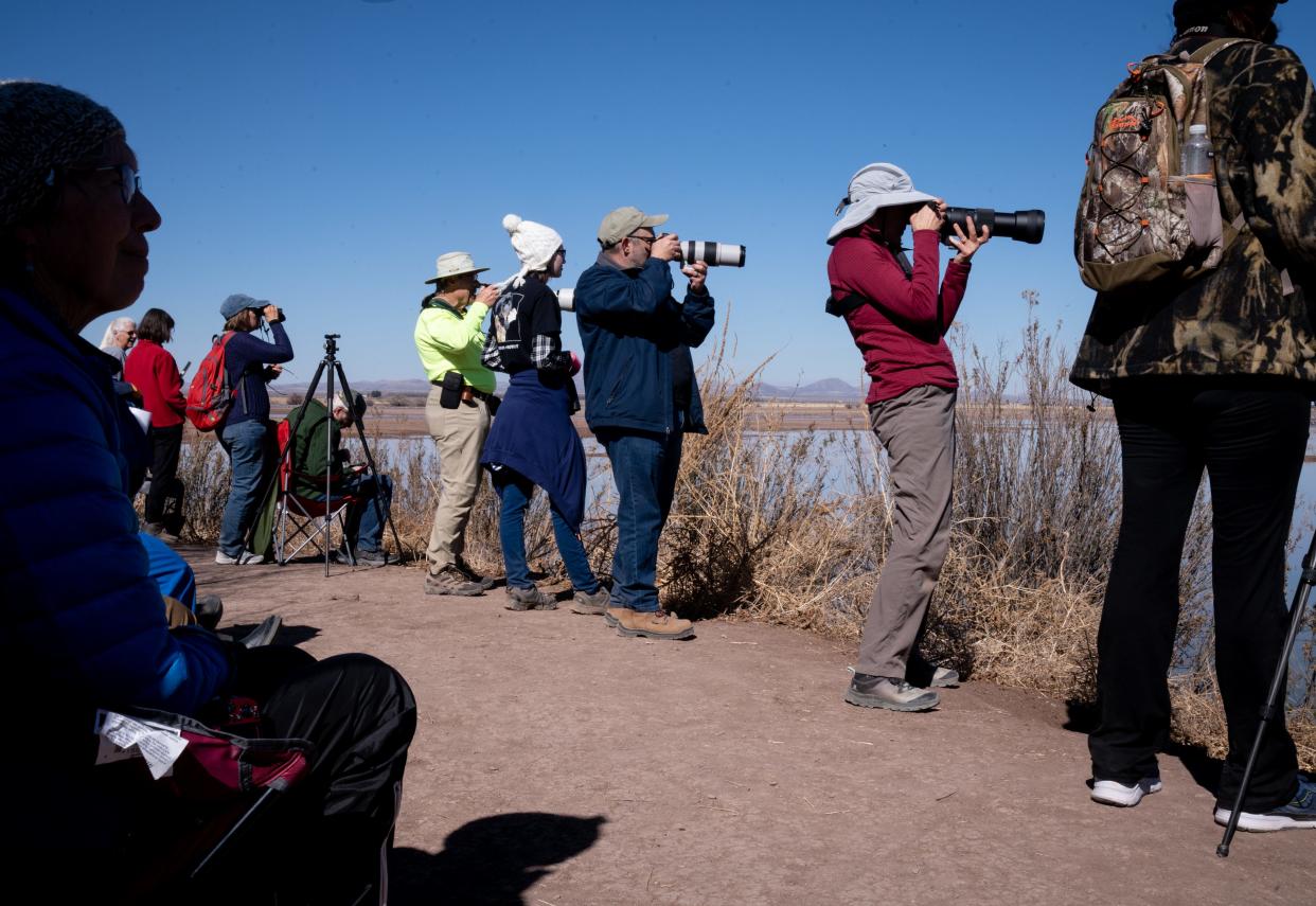 Visitors photograph the sandhill cranes, January 29, 2022, at the Whitewater Draw Wildlife Area, McNeal, Arizona.