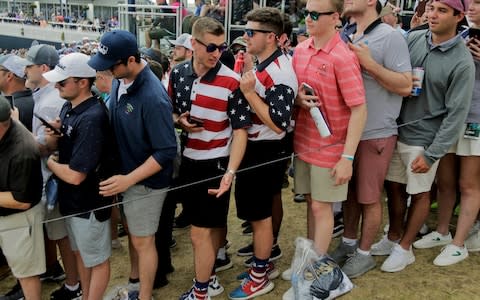 Fans prepare for the departing players on the 18th - Credit: AP