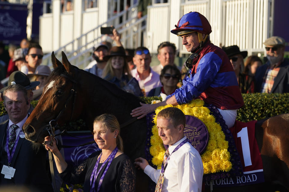 Ryan Moore celebrates on Victoria Road after winning the Breeders' Cup Juvenile Turf race at the Keenelend Race Course, Friday, Nov. 4, 2022, in Lexington, Ky. (AP Photo/Darron Cummings)