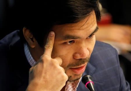 Filipino boxer and Senator Manny Pacquiao speaks during a Senate investigation of a kidnapped South Korean businessman that was allegedly killed by policemen at the police headquarters in Pasay, Metro Manila, Philippines January 26, 2017. REUTERS/Erik De Castro