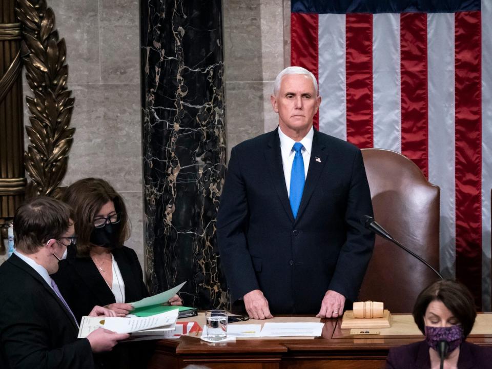 Vice President Mike Pence returns to the House chamber after midnight, Jan. 7, 2021, to finish the work of the Electoral College after a mob loyal to President Donald Trump stormed the Capitol in Washington and disrupted the process.