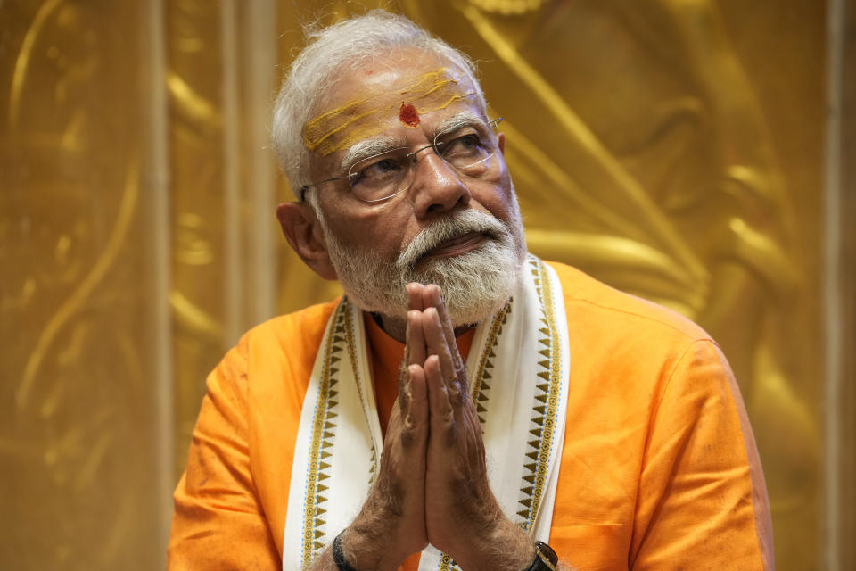 Indian Prime Minister Narendra Modi prays at Kashi Vishwanath Temple after a roadshow in Varanasi, India, Monday, May 13, 2024. (AP Photo/Rajesh Kumar)