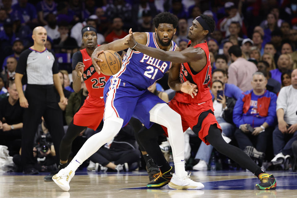 Philadelphia 76ers center Joel Embiid is guarded by Toronto Raptors' Pascal Siakam during Game 1 of their NBA playoffs first-round series on April 16, 2022, in Philadelphia. Sixers coach Doc Rivers stayed mum on the fouls the Raptors picked up while guarding Embiid. (Tim Nwachukwu/Getty Images)