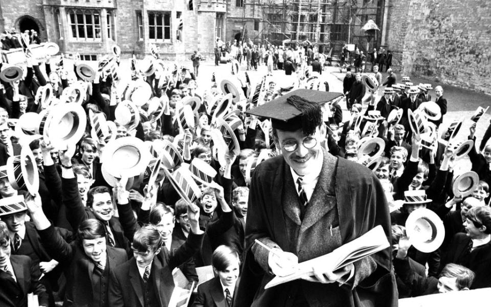 Peter O’Toole dressed for the role of Mr Chipping (Chips) is cheered by boys at Sherborne School, Dorset (Archive/PA) (PA Archive)