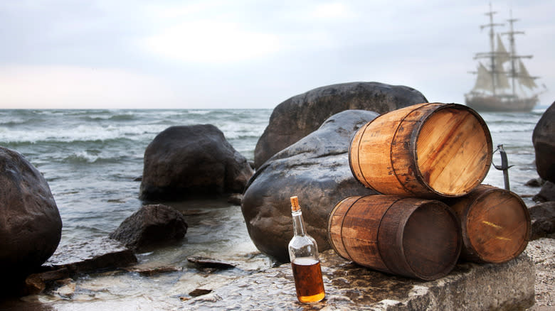 rum bottle barrels ocean ship