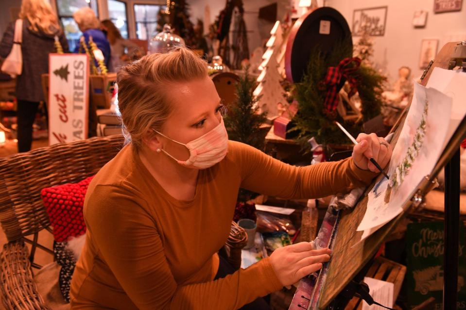 Market On Main held a holiday open house in downtown Spartanburg, November 10, 2020. Artist Jessica Fleming works on a watercolor painting at the store. .