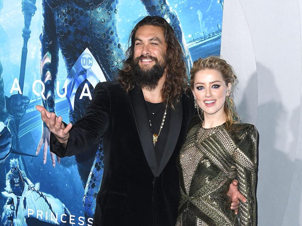 Jason Momoa, Amber Heard arrives at the Premiere Of Warner Bros. Pictures' "Aquaman" at TCL Chinese Theatre on December 12, 2018 in Hollywood, California.