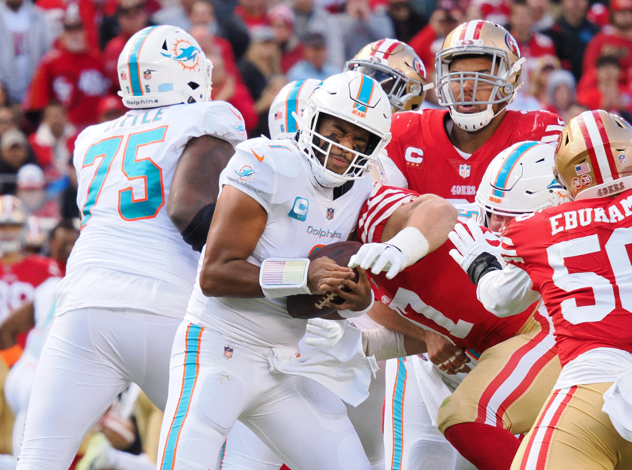 Tua Tagovailoa takes one of three sacks delivered by Nick Bosa in the 49ers' win over the Dolphins on Sunday. (Kelley L Cox-USA TODAY Sports)