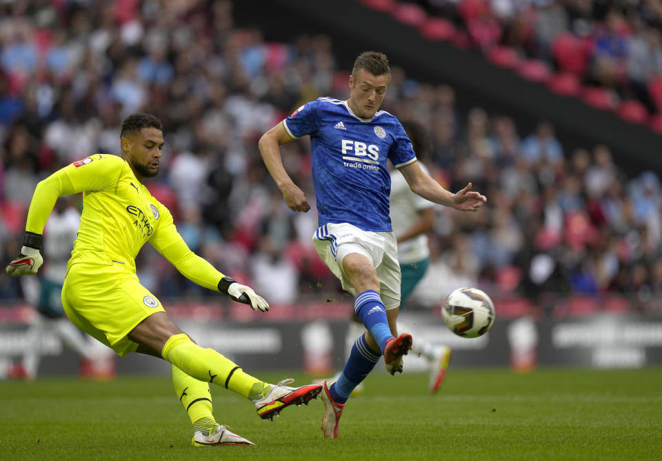 Manchester City's goalkeeper Zack Steffen, left, makes a save in front of Leicester's Jamie Vardy during the English FA Community Shield soccer match between Leicester City and Manchester City at Wembley stadium, in London, Saturday, Aug. 7, 2021. (AP Photo/Alastair Grant)