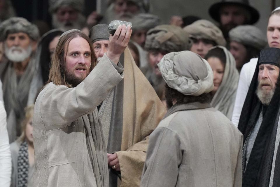 Frederik Mayet as Jesus performs during the rehearsal of the 42nd Passion Play in Oberammergau, Germany, Wednesday, May 4, 2022. More than 1800 citizens of this Bavarian village participate in the century-old play of the suffering of Christ, staged every ten years and dating back to 1634. The village had taken a vow then to escape the plague that had threatened the population. (AP Photo/Matthias Schrader)