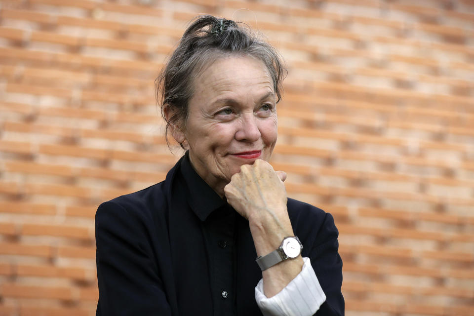 FILE - In this Sept. 11, 2016, file photo, director Laurie Anderson poses during a photo call for the movie "Heart of a Dog," in Milan, Italy. Anderson will be in conversation with Canadian author Margaret Atwood sponsored by the MacDowell artist colony, Monday, Dec. 9, 2019, in New York. (AP Photo/Luca Bruno, File)
