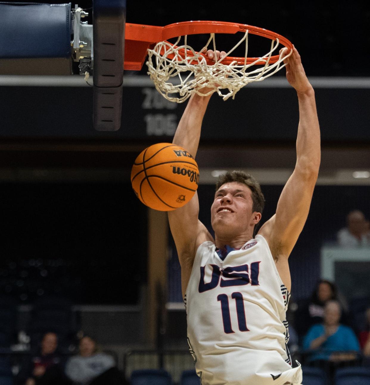 USI’s Jack Mielke (11) dunks the ball during the USI Midnight Madness event at Screaming Eagles Arena in Evansville, Ind., Thursday evening, Oct. 20, 2022. 