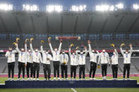 Fiji's players celebrate on the podium with their gold medals in men's rugby sevens at the 2020 Summer Olympics, Wednesday, July 28, 2021 in Tokyo, Japan. (AP Photo/Shuji Kajiyama)