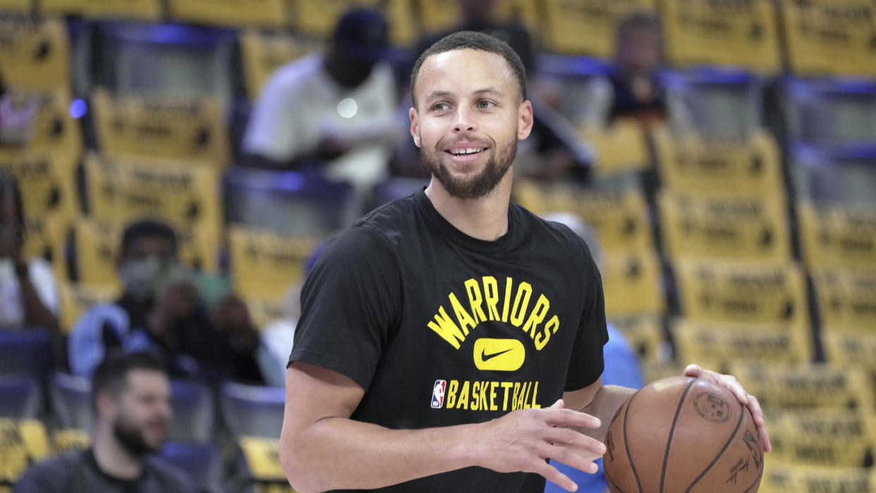 Golden State Warriors' Stephen Curry warms up prior to the first half of Game 5 of an NBA basketball second-round playoff series against the Memphis Grizzlies Wednesday, May 11, 2022, in Memphis, Tenn. (AP Photo/Karen Pulfer Focht)