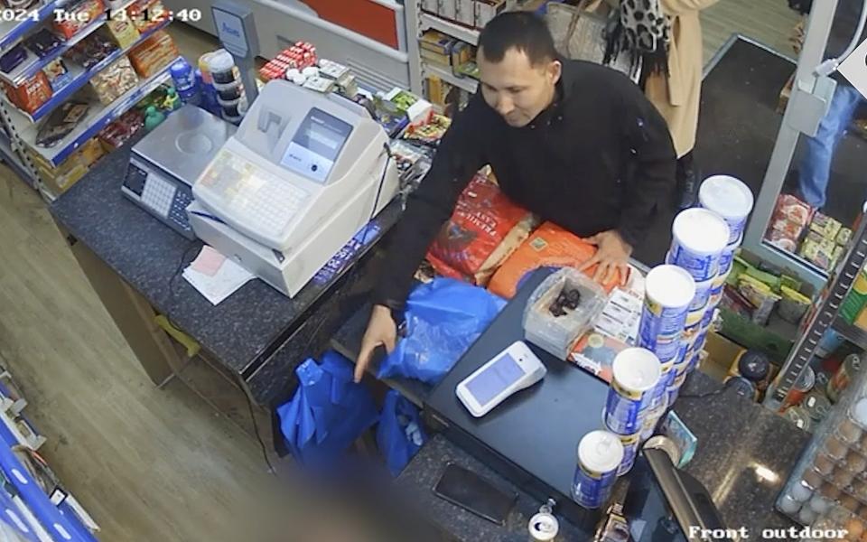 Abdul Ezedi, who is suspected of Clapham acid attack, seen on CCTV in a convenience store in Newcastle Upon Tyne