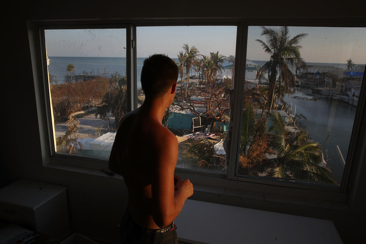 Markus Reinfandt looks out the window of his home onto the mobile homes that were destroyed by Hurricane Irma on Sept.18, 2017, in Marathon, Florida.&nbsp; (Photo: Joe Raedle/Getty Images)