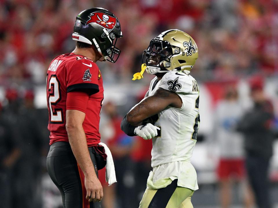 Tom Brady and C.J. Gardner-Johnson react after a play.