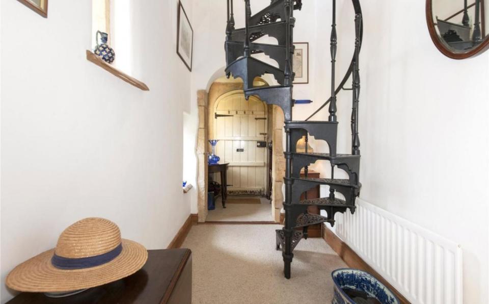 A wrought iron staircase leading up to the second floor of the building. (Savills)