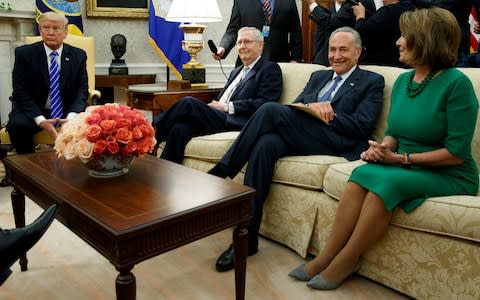  President Donald Trump pauses during a meeting with, from left, Senate Majority Leader Mitch McConnell, R-Ky., Senate Minority Leader Chuck Schumer, D-N.Y., House Minority Leader Nancy Pelosi, D-Calif., and other Congressional leaders in the Oval Office of the White House, Wednesday, Sept. 6, 2017 - Credit: AP