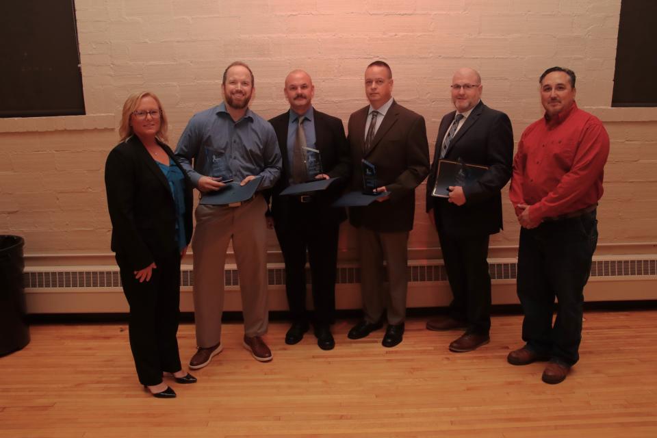 Animal Rescue heroes, from second left, Shaun Maki and Sgt. Jeff Wright and Officers Tom Gilbert and Paul Wolf of the Tecumseh Police Department, along with award presenters Deanna Brabant, left, and Sean Tennison, right, from Wacker Chemical Corp., are pictured Nov. 9 at the Everyday Heroes Awards in Adrian.