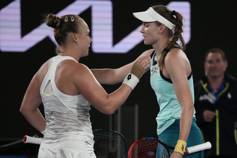 Anna Blinkova, left, of Russia is congratulated by Elena Rybakina of Kazakhstan following their second round match at the Australian Open tennis championships at Melbourne Park, Melbourne, Australia, Thursday, Jan. 18, 2024. (AP Photo/Andy Wong)