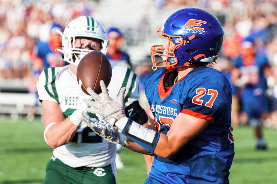 Edwardsburg's Grant Griffin (27) catches touchdown pass during the Grand Rapids West Catholic-Edwardsburg high school football game on Friday, August 25, 2023, at Leo Hoffman Field in Edwardsburg, Michigan.