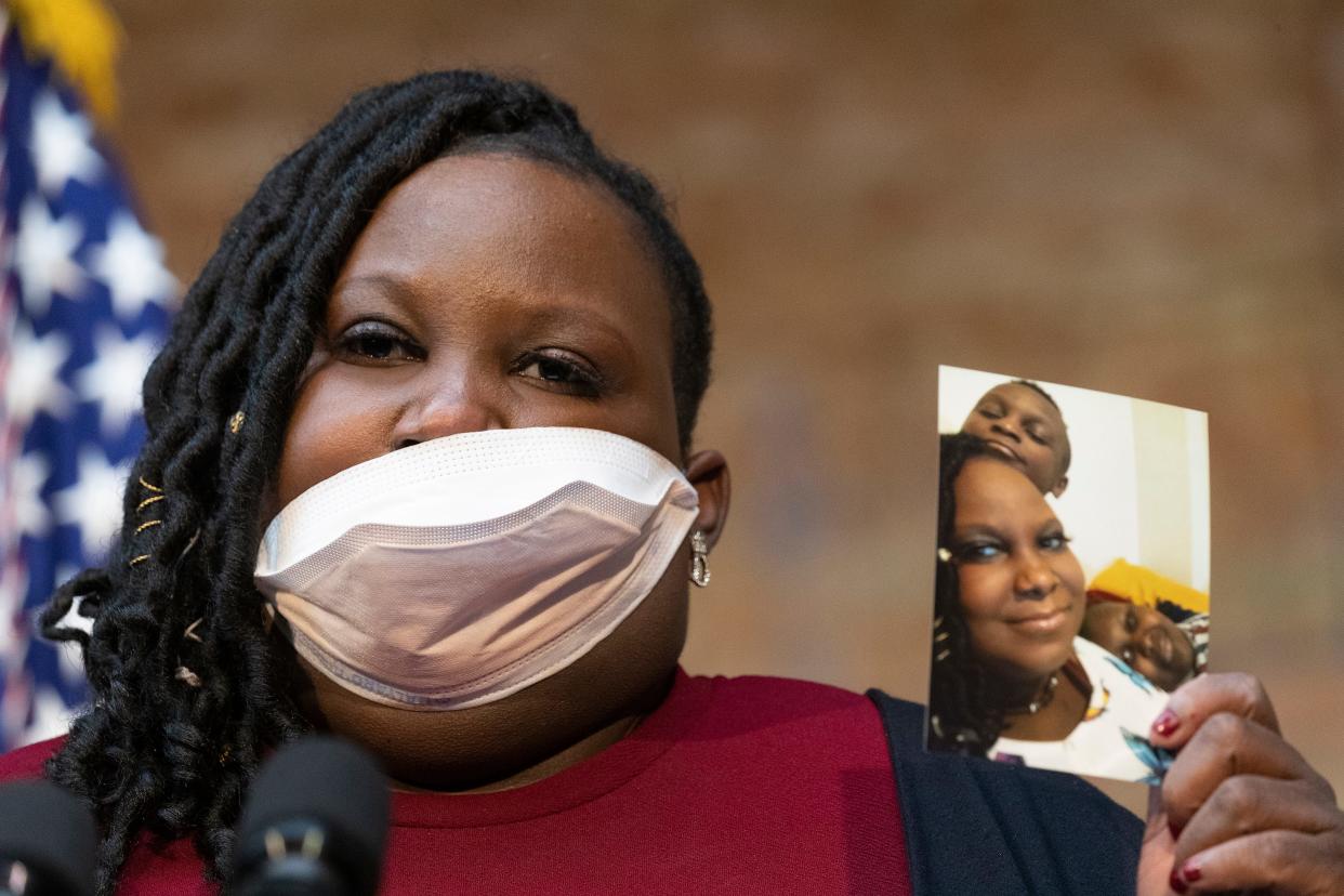 Deanna Branch holds a photo of her son, who was hospitalized twice for lead exposure, during the news conference with Vice President Kamala Harris Monday, January 24, 2022 at the Wisconsin Regional Training Partnership/ BIG STEP at 3841 W. Wisconsin Ave. in Milwaukee, Wis. Harris was joined by Michael Regan, the Environmental Protection Agency Administrator, and two top Wisconsin Democrats, U.S. Sen. Tammy Baldwin and U.S. Rep. Gwen Moore. Harris was promoting the $1 trillion bipartisan infrastructure law and focus on the push to replace lead pipes in Milwaukee and across the country.