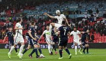 England's John Stones heads the ball during the Euro 2020 soccer championship group D match between England and Scotland at Wembley stadium in London, Friday, June 18, 2021. (Justin Tallis/Pool via AP)