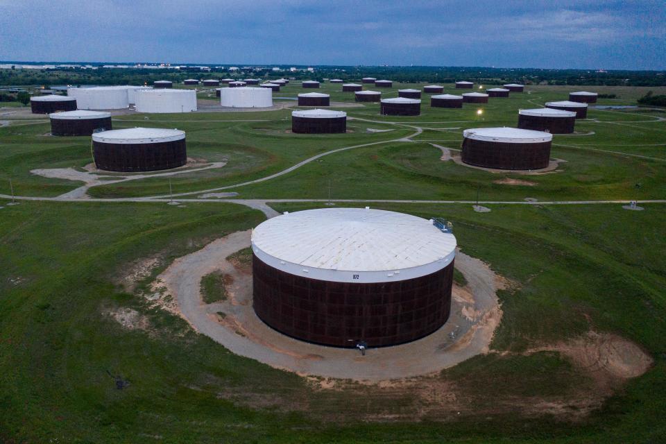An aerial view of a crude oil storage facility is seen on May 5, 2020 in Cushing, Oklahoma. - Using his fleet of drones, Dale Parrish tracks one of the most sensitive data points in the oil world: the amount of crude stored in giant steel tanks in Cushing, Oklahoma. The West Texas Intermediate oil stored in the small town in the midwestern United States is used as a reference price for crude bought and sold by refiners in Asia, hedge funds in London and traders in New York. (Photo by Johannes EISELE / AFP) (Photo by JOHANNES EISELE/AFP via Getty Images)