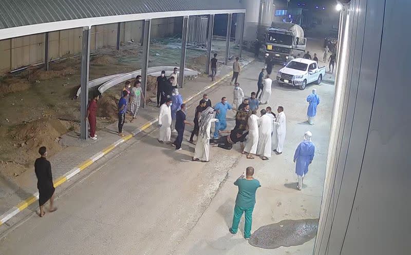 Relatives of a patient, who died from the coronavirus disease (COVID-19), beat up Tarik Sheibani, 47, an Iraqi doctor and director of Al-Amal Hospital, in this still image taken from CCTV footage obtained by Reuters, in Najaf